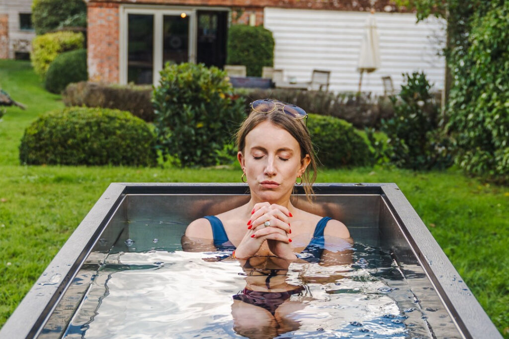 A woman in a cold plunge tub