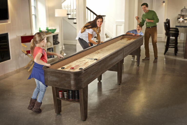 A family playing on one of their game tables